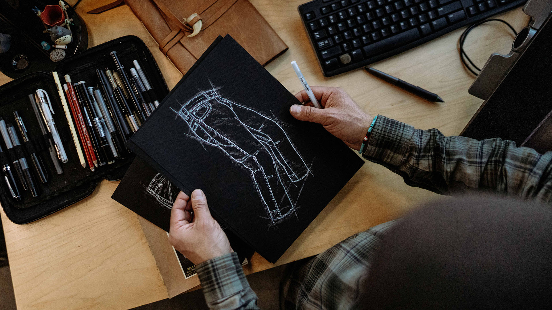 Manny's Illustrations of KUHL pants, drawings and a pencil case.