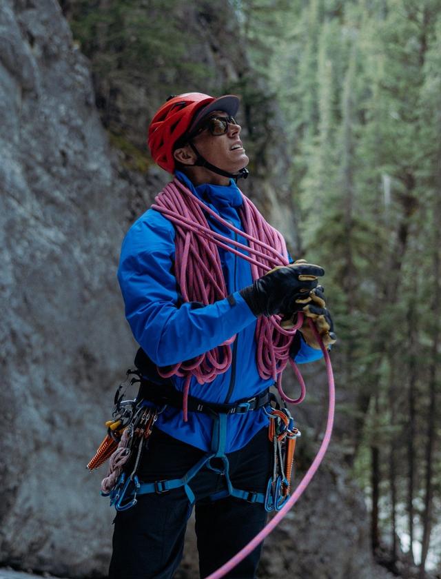 A man wearing THE ONE™ jacket while climbing